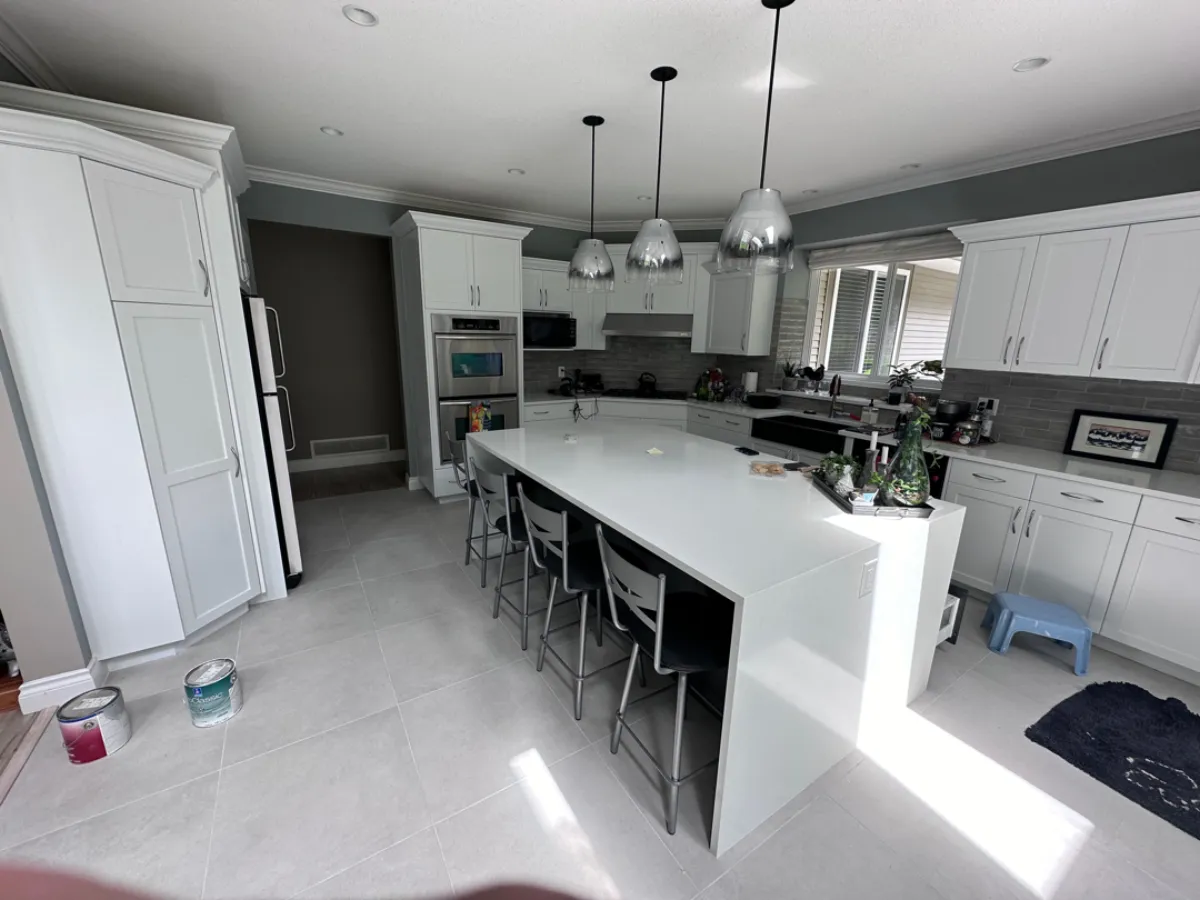 Wide view of completed Anmore kitchen renovation with island and pendant lights