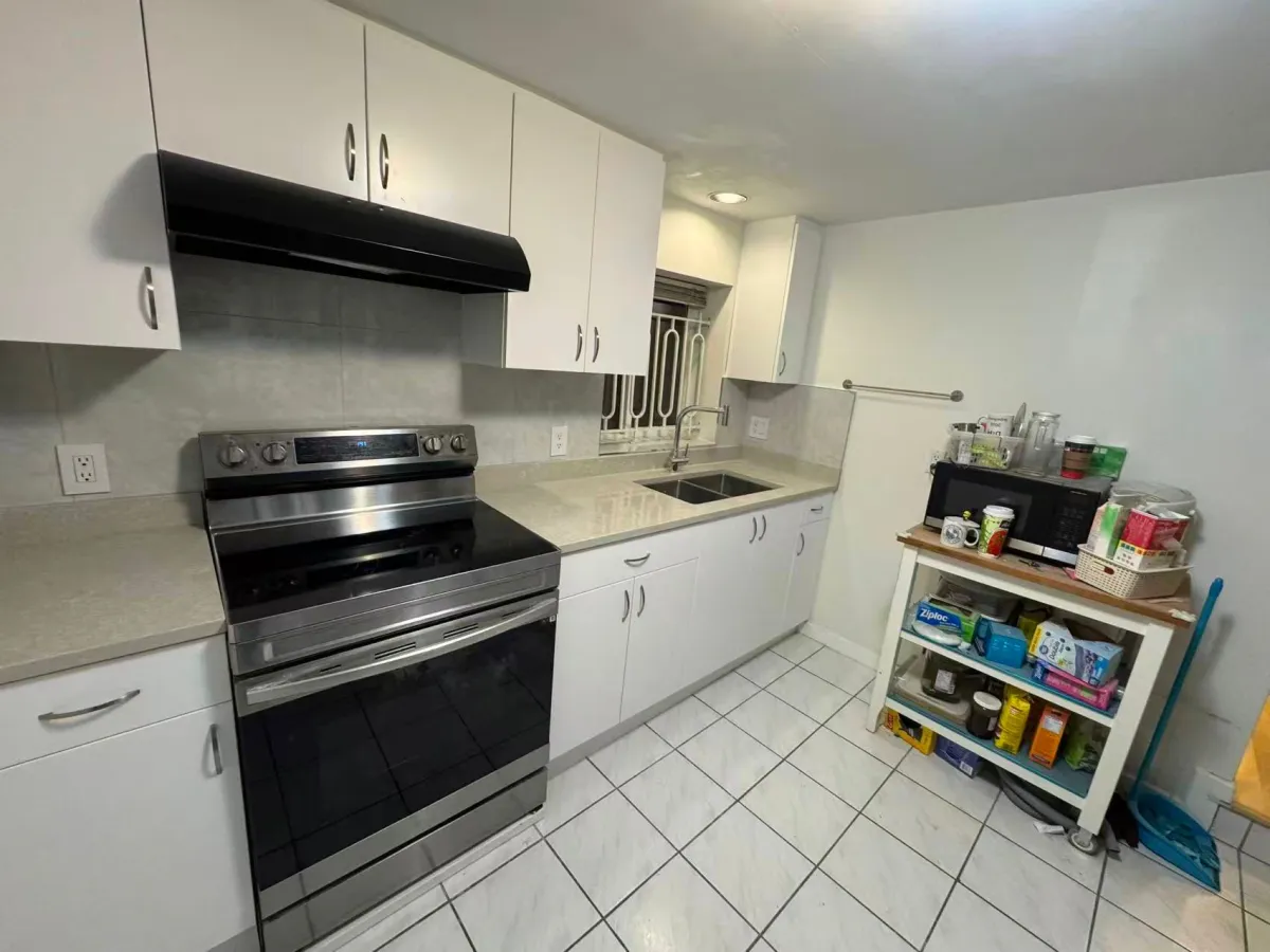 Completed kitchen renovation with new cabinets, countertops, backsplash and appliances